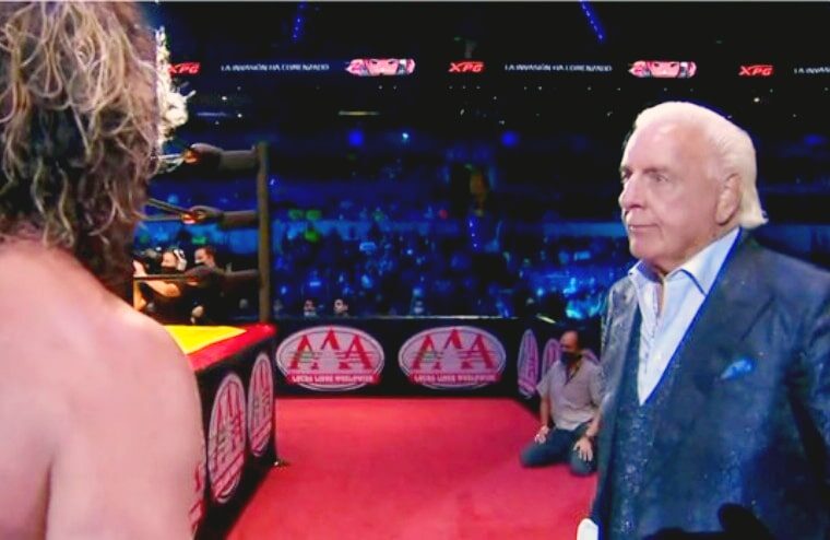 Ric Flair Appears At TripleMania & Gets Physical With Kenny Omega
