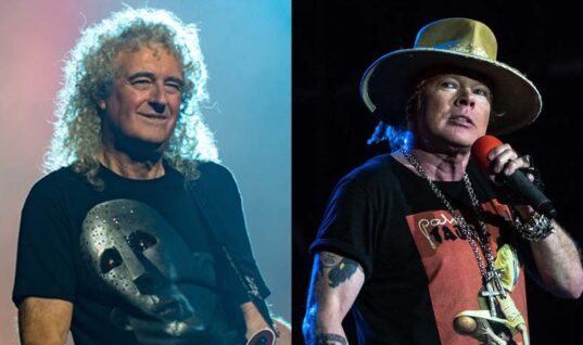 Queen’s Brian May Describes “Odd Experience” With Axl Rose