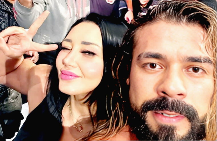 Mystery Ringside “Fan” Revealed After Andrade Selfie & Number Swap