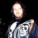 Maxx Payne Is Still Rocking His Iconic Skull-&-Flames Leather Jacket Decades Later (w/Photo)